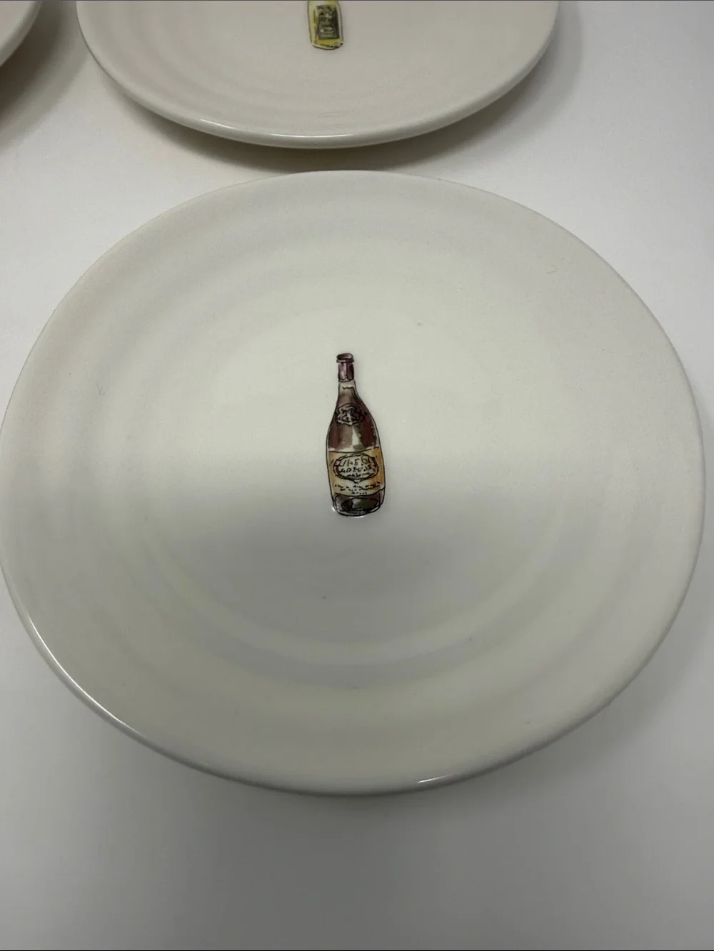 Williams Sonoma Cream Ceramic Dinner Plates with Wine Bottle Motifs - Set of 4